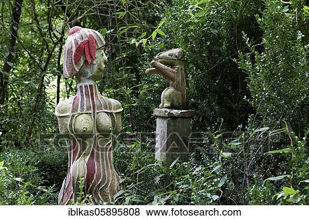 Stock Photo - Woman with little dog, figure in the sculpture garden of the artist Jochen Bach, Plinzmühle, Plinz, Großkröbitz, Milda, Thuringia, Germany, Europe. Fotosearch