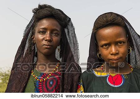 Young girls at the Gerewol festival, courtship ritual competition among the Woodaabe Fula people, Niger, Africa View Large Photo Image Picture - Young girls at the Gerewol festival, courtship ritual competition among the Woodaabe Fula people, Niger, Africa. Fotosearch