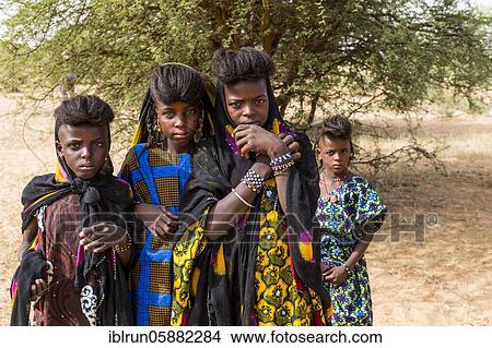Young girls at the Gerewol festival, courtship ritual competition among the Woodaabe Fula people, Niger, Africa View Large Photo Image Picture - Young girls at the Gerewol festival, courtship ritual competition among the Woodaabe Fula people, Niger, Africa. Fotosearch