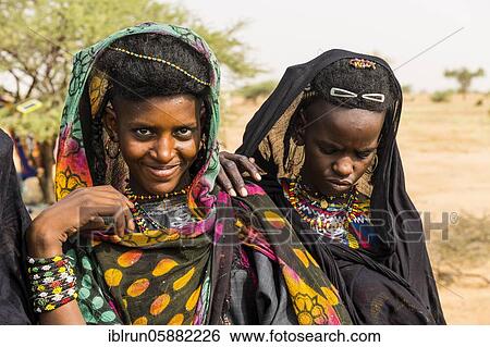 Young girls at the Gerewol festival, courtship ritual competition among the Woodaabe Fula people, Niger, Africa View Large Photo Image Stock Photograph - Young girls at the Gerewol festival, courtship ritual competition among the Woodaabe Fula people, Niger, Africa. Fotosearch
