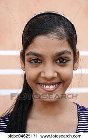Stock Image - Young Indian Woman, Portrait, Jaipur, Rajasthan, India, Asia. Fotosearch