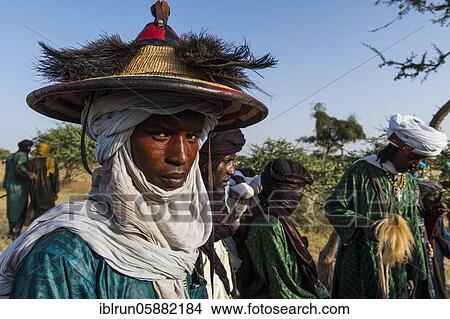 Young men arriving for the Gerewol festival, courtship ritual competition among the Woodaabe Fula people, Niger, Africa View Large Photo Image Picture - Young men arriving for the Gerewol festival, courtship ritual competition among the Woodaabe Fula people, Niger, Africa. Fotosearch