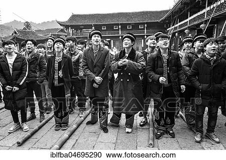 Stock Image - Young people preparing a production in which they rob unmarried woman from a balcony, Ping'An, Zhangjiajie National Forest Park, China, Asia. Fotosearch