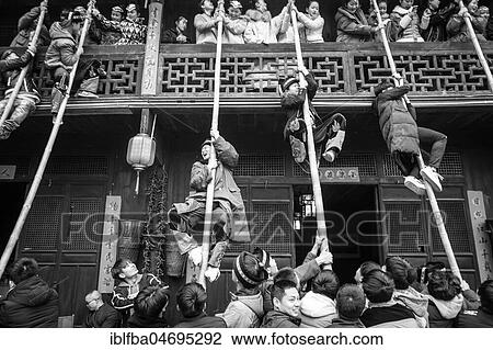 Stock Image - Young people preparing a production in which they rob unmarried woman from a balcony, Ping'An, Zhangjiajie National Forest Park, China, Asia. Fotosearch