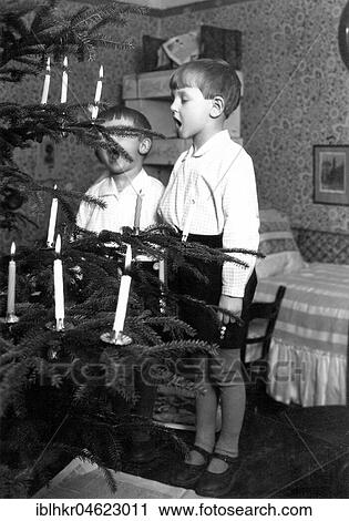 2 boys singing christmas tree, ca. 1930, exact place unknown, Germany, Europe View Large Photo Image Stock Image - 2 boys singing christmas tree, ca. 1930, exact place unknown, Germany, Europe. Fotosearch