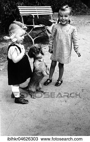 2 girls with dog (Dackel), ca. 1955, Leipzig, Germany, Europe View Large Photo Image Stock Image - 2 girls with dog (Dackel), ca. 1955, Leipzig, Germany, Europe. Fotosearch