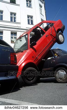 Stock Photograph - A car trapped between two cars, Berlin, Germany, Europe. Fotosearch