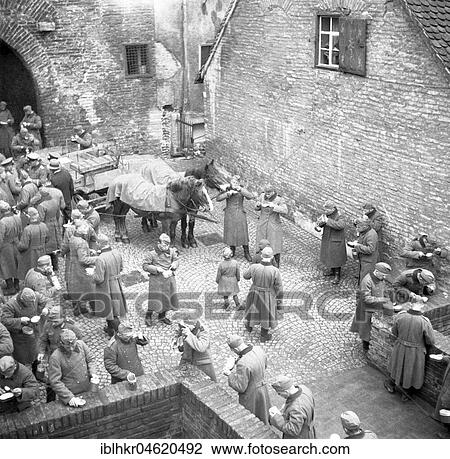 Stock Image - Approx. 1939, 1941, training Wehrmacht, original caption: Ulm, Food serving in the butcher's tower, Ulm, Germany, Europe. Fotosearch