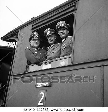 Approx. 1939, 1941, training Wehrmacht, three Wehrmacht officers look out of a train window, Ulm, Germany, Europe View Large Photo Image Stock Photography - Approx. 1939, 1941, training Wehrmacht, three Wehrmacht officers look out of a train window, Ulm, Germany, Europe. Fotosearch