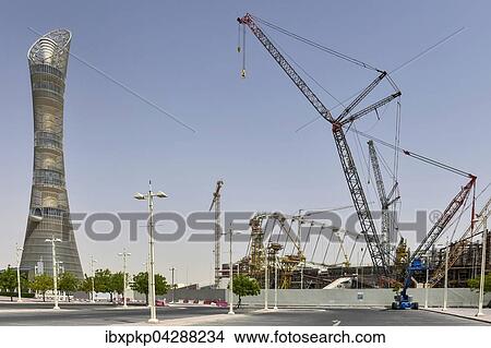 Aspire Tower und Baustelle des Khalifa International Stadium, Doha, Katar, Asien View Large Photo Image Picture - Aspire Tower und Baustelle des Khalifa International Stadium, Doha, Katar, Asien. Fotosearch