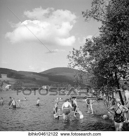 Stock Image - Bathing people in a lake near Freiburg, approx. 1945 to 1955, surroundings of Freiburg, Germany, Europe. Fotosearch