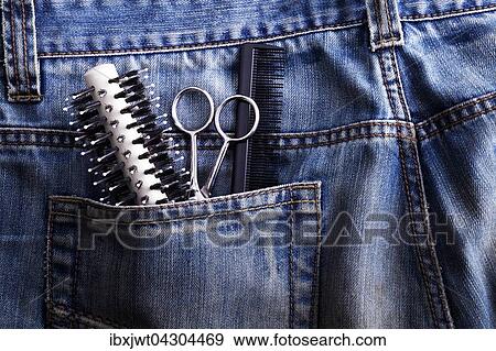Burste, Schere, Kamm in der Hosentasche einer Jeans View Large Photo Image Stock Photo - Burste, Schere, Kamm in der Hosentasche einer Jeans. Fotosearch