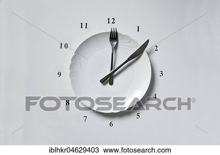 Stock Image - Clock from plate Knife and fork. Fotosearch