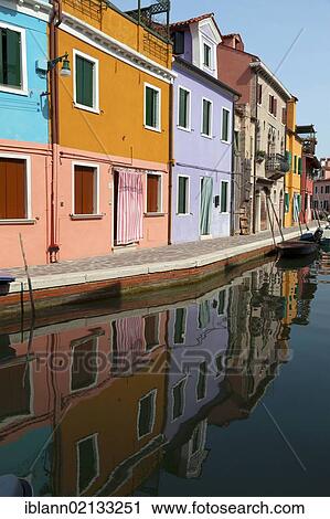 Stock Image - Colorful houses, reflected in a canal in Burano, Venice, Spain, Europe. Fotosearch