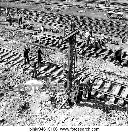Stock Photograph - Construction worker, track construction, ca. 1945 to 1955, near Freiburg, Germany, Europe. Fotosearch