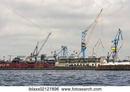 Stock Photograph - Container cranes at Dock 16, Port of Hamburg, Hamburg, Germany, Europe. Fotosearch