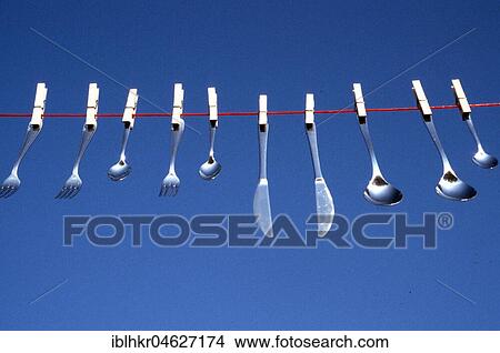 Cutlery on a clothesline, Berlin, Germany, Europe View Large Photo Image Picture - Cutlery on a clothesline, Berlin, Germany, Europe. Fotosearch