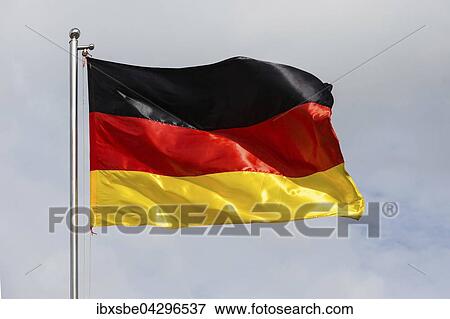 Stock Photo - Deutsche Flagge, Bundesflagge weht im Wind. Fotosearch