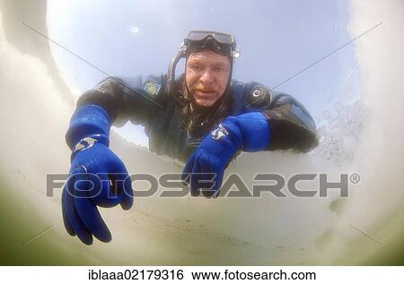 Diver giving the OK sign, preparations for subglacial diving, ice diving, in the frozen Black Sea, a rare phenomenon, last time it occured in 1977, Odessa, Ukraine, Eastern Europe, Europe View Large Photo Image Stock Photograph - Diver giving the OK sign, preparations for subglacial diving, ice diving, in the frozen Black Sea, a rare phenomenon, last time it occured in 1977, Odessa, Ukraine, Eastern Europe, Europe. Fotosearch