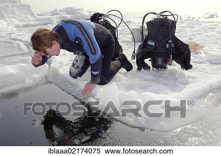 Diver, preparing for subglacial diving, ice diving, in the frozen Black Sea, a rare phenomenon, last time it occured in 1977, Odessa, Ukraine, Eastern Europe, Europe View Large Photo Image Stock Photography - Diver, preparing for subglacial diving, ice diving, in the frozen Black Sea, a rare phenomenon, last time it occured in 1977, Odessa, Ukraine, Eastern Europe, Europe. Fotosearch