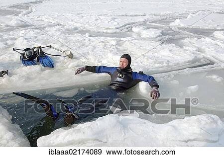 Diver, subglacial diving, ice diving, in the frozen Black Sea, a rare phenomenon, last time it occured in 1977, Odessa, Ukraine, Eastern Europe, Europe View Large Photo Image Stock Photo - Diver, subglacial diving, ice diving, in the frozen Black Sea, a rare phenomenon, last time it occured in 1977, Odessa, Ukraine, Eastern Europe, Europe. Fotosearch
