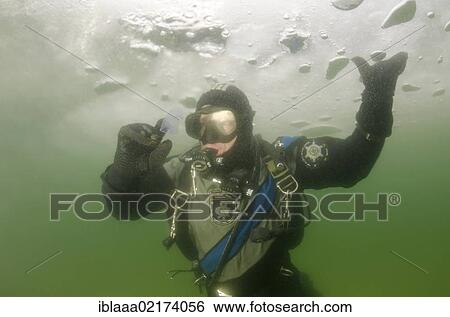 Diver, subglacial diving, ice diving, in the frozen Black Sea, a rare phenomenon, last time it occured in 1977, Odessa, Ukraine, Eastern Europe, Europe View Large Photo Image Stock Photograph - Diver, subglacial diving, ice diving, in the frozen Black Sea, a rare phenomenon, last time it occured in 1977, Odessa, Ukraine, Eastern Europe, Europe. Fotosearch