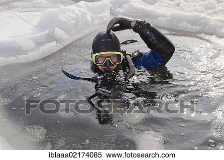 Diver, subglacial diving, ice diving, in the frozen Black Sea, a rare phenomenon, last time it occured in 1977, Odessa, Ukraine, Eastern Europe, Europe View Large Photo Image Stock Photography - Diver, subglacial diving, ice diving, in the frozen Black Sea, a rare phenomenon, last time it occured in 1977, Odessa, Ukraine, Eastern Europe, Europe. Fotosearch