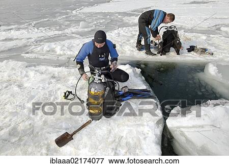 Divers, preparing for subglacial diving, ice diving, in the frozen Black Sea, a rare phenomenon, last time it occured in 1977, Odessa, Ukraine, Eastern Europe, Europe View Large Photo Image Stock Photo - Divers, preparing for subglacial diving, ice diving, in the frozen Black Sea, a rare phenomenon, last time it occured in 1977, Odessa, Ukraine, Eastern Europe, Europe. Fotosearch