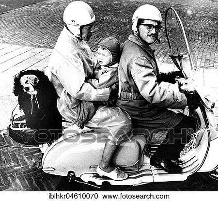 Stock Image - Family with dog on motorcycle, Mexico City, Mexico, Central America. Fotosearch