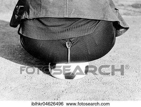 Fat man sits on soccer ball, ca. 1980s, East Berlin, GDR, Germany, Europe View Large Photo Image Stock Photograph - Fat man sits on soccer ball, ca. 1980s, East Berlin, GDR, Germany, Europe. Fotosearch
