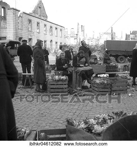 Flower sellers are waiting for customers, in the background: Ruins of Freiburg, Freiburger Münstermarkt, approx. 1945 to 1955, Freiburg, Germany, Europe View Large Photo Image Stock Image - Flower sellers are waiting for customers, in the background: Ruins of Freiburg, Freiburger Münstermarkt, approx. 1945 to 1955, Freiburg, Germany, Europe. Fotosearch