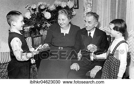 Stock Image - Grandchildren congratulate golden wedding approx. 50's, exact place unknown, Germany, Europe. Fotosearch