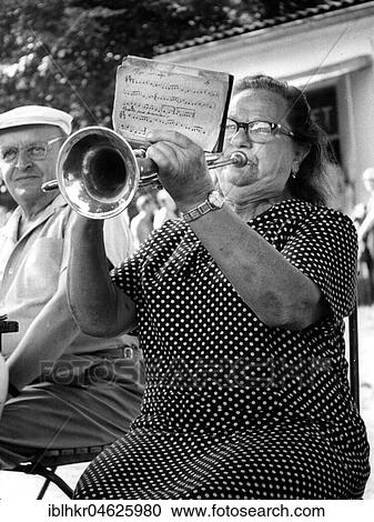 Grandma plays trumpet ca. 1970s, exact place unknown, Czech Republic, Europe View Large Photo Image Stock Image - Grandma plays trumpet ca. 1970s, exact place unknown, Czech Republic, Europe. Fotosearch