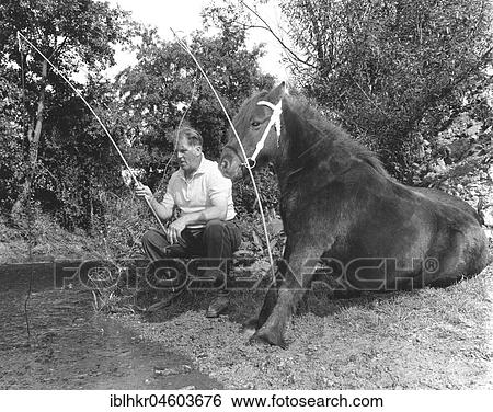Horse and man fishing, England, Great Britain View Large Photo Image Stock Photograph - Horse and man fishing, England, Great Britain. Fotosearch