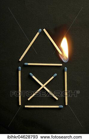 Stock Image - House symbol of matches with a burning match. Fotosearch
