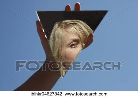 Stock Image - Identity crisis, Woman reflected, Germany, Europe. Fotosearch