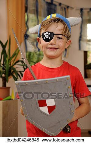 Junge als Wikinger mit Piraten-Augenklappe, Schild und Schwert, Deutschland, Europa View Large Photo Image Stock Photography - Junge als Wikinger mit Piraten-Augenklappe, Schild und Schwert, Deutschland, Europa. Fotosearch