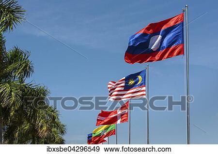 Laotische, malayische, und danische Flagge wehen im Wind, blauer Himmel, Sisowath Quay, Phnom Penh, Kambodscha, Asien View Large Photo Image Stock Photo - Laotische, malayische, und danische Flagge wehen im Wind, blauer Himmel, Sisowath Quay, Phnom Penh, Kambodscha, Asien. Fotosearch