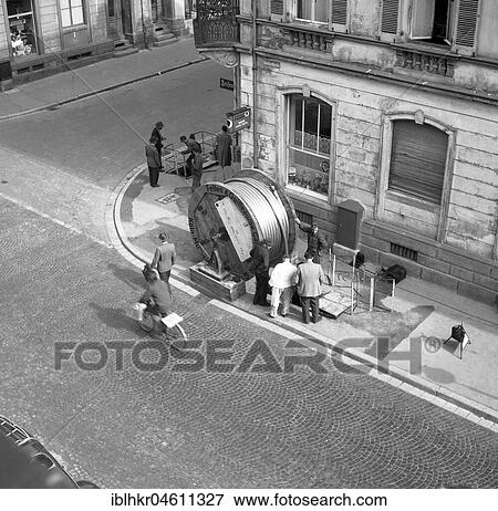 Stock Photo - Laying of cables, road works, ca. 1955, Freiburg, Germany, Europe. Fotosearch