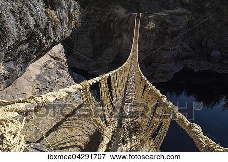 Letzte funktionierende Inka Hangebrucke Qu'eswachaka, Seilbrucke aus geflochtenem Ichu-Gras (Jarava ichu) uber den Fluss Apurimac, Peru, Sudamerika View Large Photo Image Stock Photo - Letzte funktionierende Inka Hangebrucke Qu'eswachaka, Seilbrucke aus geflochtenem Ichu-Gras (Jarava ichu) uber den Fluss Apurimac, Peru, Sudamerika. Fotosearch