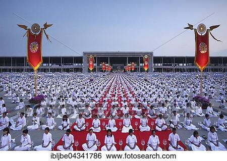 Makha Bucha Day, Magha Puja Day, Theravada Buddhist holiday, mass meeting with monks and religious people in Wat Phra Dhammakaya, Khlong Luang District, Pathum Thani, Bangkok, Thailand, Asia *** IMPORTANT: Image must not be used in a negative context... View Large Photo Image Stock Photograph - Makha Bucha Day, Magha Puja Day, Theravada Buddhist holiday, mass meeting with monks and religious people in Wat Phra Dhammakaya, Khlong Luang District, Pathum Thani, Bangkok, Thailand, Asia *** IMPORTANT: Image must not be used in a negative context.... Fotosearch