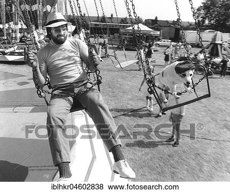 Man and Jack Russell Terrier driving a carousel, England, Great Britain View Large Photo Image Stock Photo - Man and Jack Russell Terrier driving a carousel, England, Great Britain. Fotosearch