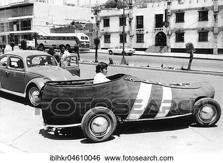Man driving Car as a sneaker, Mexico City, Mexico, Central America View Large Photo Image Stock Photograph - Man driving Car as a sneaker, Mexico City, Mexico, Central America. Fotosearch