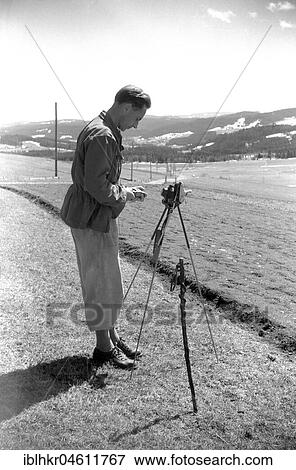 Man is photographing the landscape around 1950 in Freiburg, near Freiburg, Germany, Europe View Large Photo Image Stock Photo - Man is photographing the landscape around 1950 in Freiburg, near Freiburg, Germany, Europe. Fotosearch