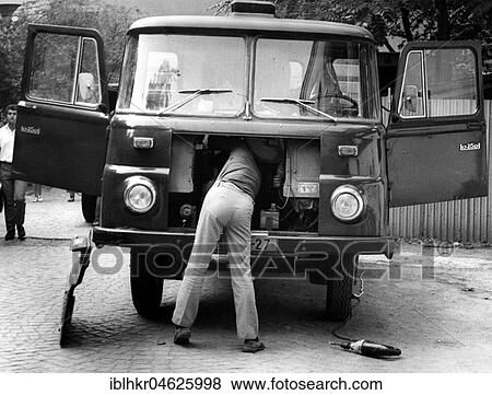 Man repairing trucks ca. 1970s, exact place unknown, Czech Republic, Europe View Large Photo Image Stock Photo - Man repairing trucks ca. 1970s, exact place unknown, Czech Republic, Europe. Fotosearch