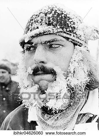 Stock Image - Man with icicle on his face ca. 1970s, exact place unknown, Czech Republic, Europe. Fotosearch