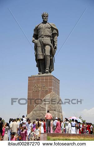 Stock Image - Many people below the monument of Amir Timur Shahrisabz Uzbekistan. Fotosearch