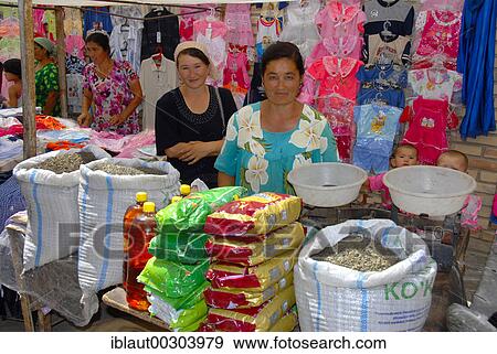 Market women sell loose tea and colourful clothes Khiva Uzbekistan View Large Photo Image Stock Photo - Market women sell loose tea and colourful clothes Khiva Uzbekistan. Fotosearch