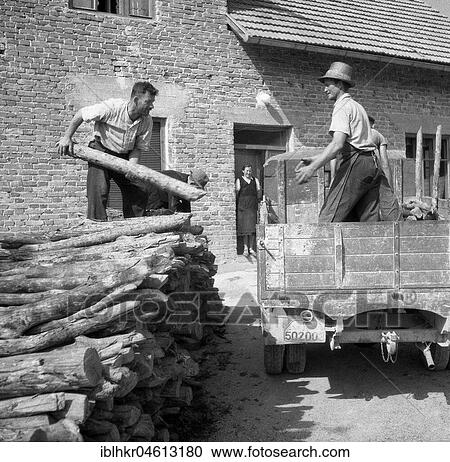 Men load logs onto a wagon, ca. 1945 to 1955, near Freiburg, Germany, Europe View Large Photo Image Stock Image - Men load logs onto a wagon, ca. 1945 to 1955, near Freiburg, Germany, Europe. Fotosearch