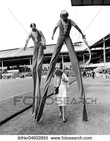 Stock Photography - Men on stilts, England, Great Britain. Fotosearch